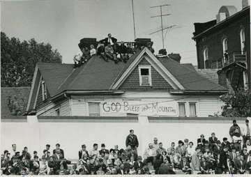 Sign reads 'God bless the Mounties'.