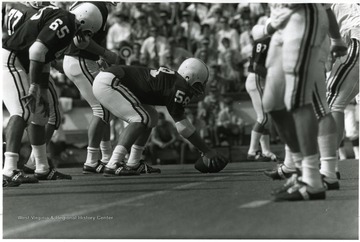 Center Prepares to Snap the Ball.