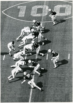 Cincinnati's quarterback prepares to hand off the ball.