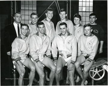 Seated: Bernie Marcinek, Co. Capt. Phil Minnes and Ray Brace, George Zitman.  Standing: Coach Jack Lowder, George Hazlet, Gene Reiff, Dave Meiser, Bette Hushla, Manager Joe Prete.