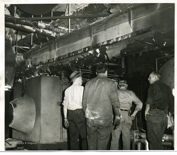 Fire inspectors survey the damage of the Medical Center fire, in West Virginia University.