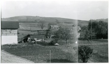 'Bulldozers at work on top of hill for the University Medical School.'