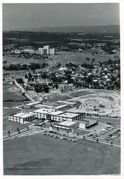 'Top to bottom: Medical Center, Twin Towers (under construction), Forestry Building (under construction), Agricultural Engineering Building.'