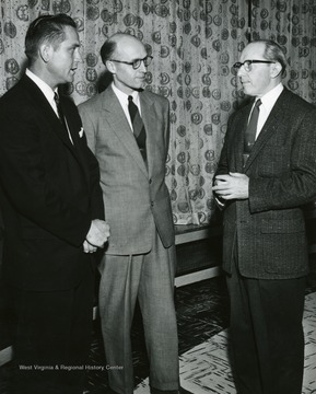 Two presidents and their host meet to discuss the joint meeting of the Philosophy Section of the Ohio College Association and the West Virginia Philosophy Society held on the Ohio University campus during the weekend. They are, left to right, Virgil Hinshaw Jr., of Ohio State University, president of the Ohio group; Dr, Troy Organ of OU`s philosophy department, and William S. Minor of West Virginia University, president of the West Virginia society. Nearly 100 faculty and students from 20 colleges and universities attended the reading of papers and discussions during the two-day meet.