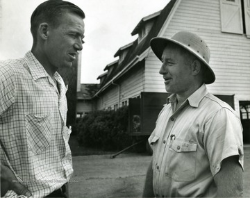 Left to right, Ira Deward Porterfield, Professor and Head of Dairy Husbandry, Clark Hardman Taylor, Dairy Farm Superintendent.