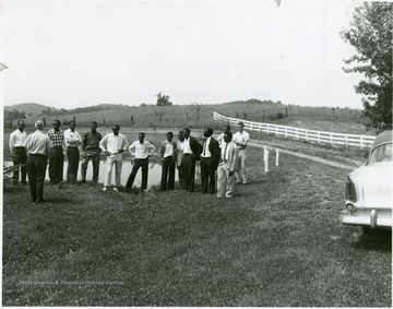 International Students from Tanganyika (now Tanzania) standing near a pond.