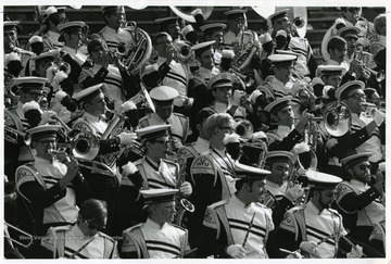 WVU marching band performs from the football stands.