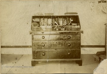 This desk was used by Randal. We cannot say he wrote his sermons here as I have seen only two sermons written by him. This desk is now is the parsonage at New Durham. Some of the partitions of the pigeon holes are said to have been put in by Randal himself.