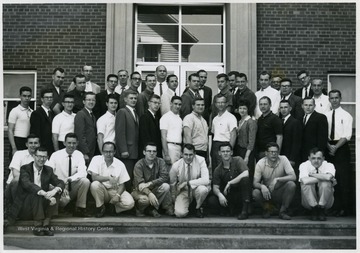 A group portrait of students and instructors of the WVU Physics Department. 