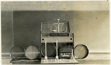A photograph of a piece of lab or testing equipment in a classroom.