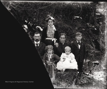 A portrait of a couple and five children.