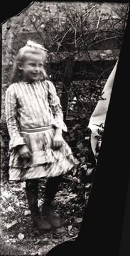 A portrait of girl in striped dress.