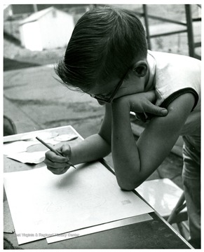 An unidentified boy plans (metal etching).