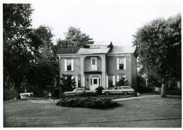 In the photo shown here are some damage done on John and Betty Wyatt's house and antique shop on Virginia Avenue after the tornado.  The building is now occupied  by Venture Real Estate Co. 