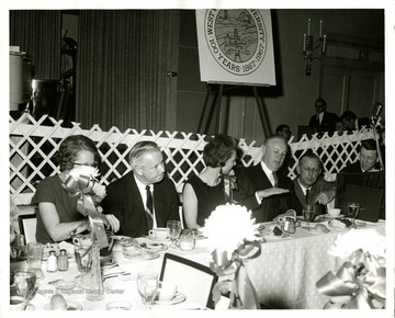 Congressman Arch Moore and Governor Hulett Smith and WVU President Harry Heflin on the end in the picture.