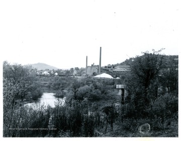 A view of Adamston Flat Glass taken from the Rt. 19 Shinston Rd. at Adamston, W. Va.  The river is West Fork River.