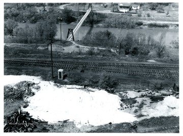 A view of back lot of Adamston Flat Glass piled with junk.   