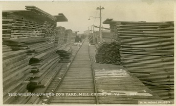 'Wood's operation Tygarts River Lumber Company, Mill Creek, W. Va., showing logging on Mill Creek. Cards furnished by Robert G. Kay, West Chester, Pennsylvania November 1951.' On the front of the photo: 'Camp # 1, Log loader at work. This shows the steepest grade on the road'.