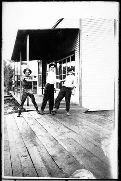 This one story building erected on the site of Huffman's Store which burned in 1916, is still being used as a store by Harold Sites. Left to right: Hobe Smith, John Spitzer, Dave Teter.