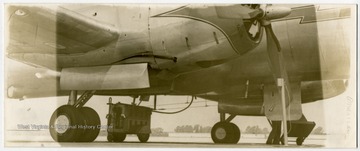 Propeller-Powered American Airlines passenger aircraft on airport runway.