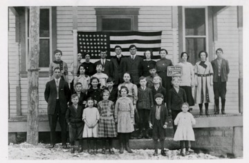 Front row: Harley Johnson, Edna Weaver, Martha Scott, Lorna (?) Newbraugh, Paul Brock, and Grace Weaver. Next row: Jessie Weaver, Myrtle Scott, Harvey Johnson, Nettie Arnett, Ralph Brand, Raymond Scott, Leslie Henry. Middle Row: (Teacher) Clifford Pindell Coombs, Ollie Brock, Mazzie Arnett, Boy--a Newbraugh Lonnie (?). Back row: Roxiw Myrtle, Mae Crock, Bessie Tricket, Byron Morgan Brans, Leslie Fisher, Brooks Lanham, Tola Henry, Hazel Brand, Wilma Brock, Willa Brock and William Lanham.