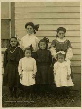 Post card print of unidentified children. Inscription on the back "For Grandma Haldeman, from Mrs. Smith"