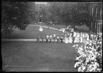 Crowd gathers for the ceremony inaugurating Thomas Hodges as President of West Virginia University. Among the distinguished guests was United States President William H. Taft.