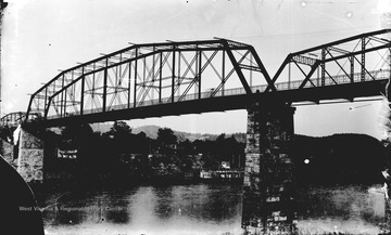 The photograph was taken from the Morgantown riverbank. Note the steam powered riverboat, "Iron Cliff" docked on the Westover side.