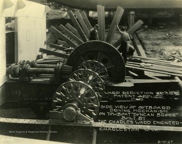 Side view of outboard driving mechanism of the steam powered wheel on the Duncan Bruce, created by The Charles Ward Engineering Works in Charleston, West Virginia.