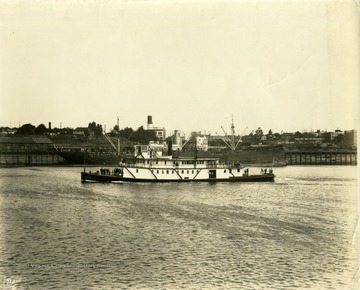 Towboat "Shaver" built by The Charles Ward Engineering Works in Charleston, West Virginia. Note the ship docked behind the "Shaver", the "West Niger", has swastika on its stack.