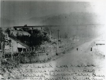 Inscribed on the front by Achilles Murat Long, : "The old log house that was where I was raised. This was torn down and another house built." Information on the back: "Stephen D. Trail Summers County Collection, W. V., Roy Long Collection 1998"