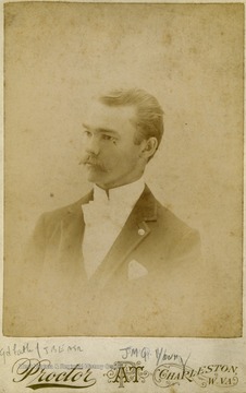 A cabinet card portrait of J. M. Q. Young, "J.B.E.'s grandfather", dressed in formal attire.