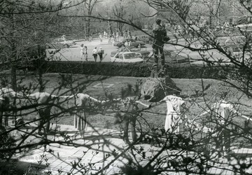 WVU student protest - "Death of Higher Education", holding hands, stretched in single line, behind the "Mountaineer", in front of Mountainlair, Morgantown, West Virginia.