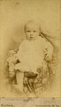 A carte de visite of a small, bare-foot boy named Harry.