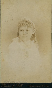 A carte de visite of a young girl in curls.