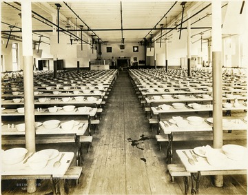 Neatly set tables for dining in the Inmates' Mess Hall at state prison.