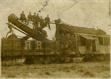 Only identified worker, fourth from the left is Herbert Swats. Inscribed on the back of the photograph postcard: "2000 ... From David Ballard".