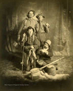 Pictured are Ed Dyke, Shan Rose, Ed Rose and W. J. Taylor. The men caught 38 black bass. Dyke and the two Roses are from Hinton, West Virginia and Taylor is from Cincinnati, Ohio. Inscribed on the back: "from Miller Murrel to Stephen Trail 2009." 