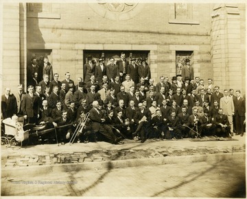 Unidentified subjects include several musicians holding instruments and a baby sitting in a carriage.