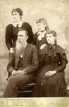 Alexander Summers, Eda. A. Albert. Summers, daughters standing El May Balyard and Mandana Summers.