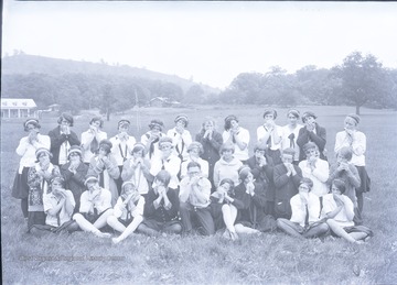 A band of 4-H members play they "mouth organs" or harmonicas on the front lawn at Jackson's Mill.