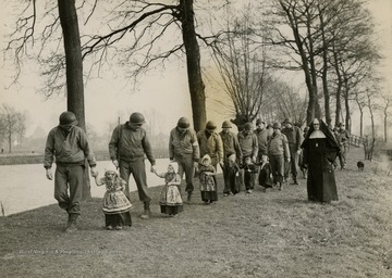 The photograph was most likely taken in Holland, which had been under Nazi control for several years until portions of the country was liberated by the Allies in the Fall of 1944 during Operation Market Garden.