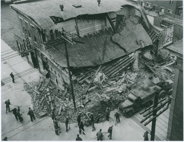 Building collapsed after the local power company dug a trench to bury their lines too close to the building. 