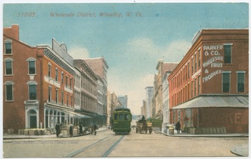 Store on right says Parker &amp; Co. Wholesale Fruit &amp; Produce.