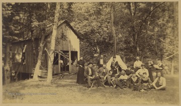 Group portrait of Hilarity Club members at their outdoor base.