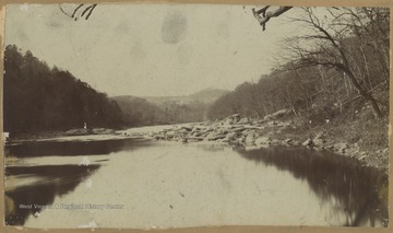 Photo looking down the river and into the distant mountains. 