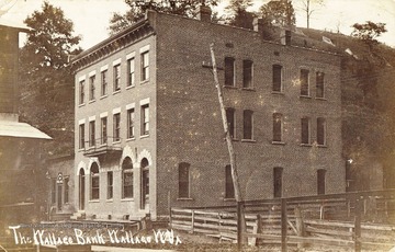 Building connected to the bank is a pool hall.