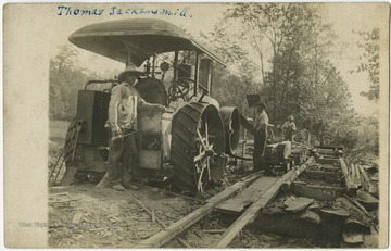 Portrait of employees working outside. See original for correspondence. 