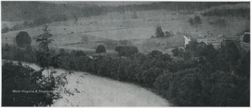 The hotel, pictured on the far right, sits close to the river. 