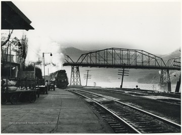 A train approaches the platform on the C&amp;O Railroad. 